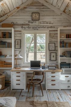 a home office with built in bookshelves and white painted wooden walls, along with lots of natural wood flooring