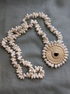 Vintage beach jewelry shell Operculum costume jewelry necklace for the summer.  Good vintage condition. Unique Shell Necklace For Beach, Unique Shell-shaped Shell Necklaces, Unique White Shell Pendant Necklace, Unique White Pendant Shell Necklace, Traditional Cowrie Shell Jewelry For Beach, Shell Pendant Jewelry For Vacation, Beach Pendant Jewelry Made Of Shell, Handmade Shell Pendant Necklace For Beach, Handmade Pendant Shell Necklace For Beach