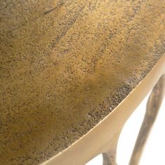 a close up of a metal table with dirt on the top and bottom part of it