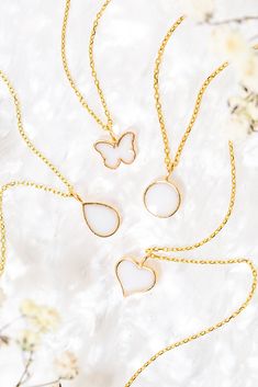 Embrace the beauty of a cherished memory with the Liquid Gold Drop Petite Charm, a delicate and timeless addition to any bracelet or necklace. This petite charm features a teardrop design, reminiscent of a glistening drop of liquid gold, and offers a special way to hold a treasured piece of your story close. Personalize with: Breastmilk - A cherished symbol of the mother-child bond.Cremation ashes - Honor the memory of a loved one.Placenta - Celebrate the miracle of life.Umbilical cord - Symbolize a special connection.Dried flowers - Add a sentimental touch.Hair - Keep a piece of someone close. A unique and sentimental gift for: Mothers celebrating motherhoodNew parents commemorating a birthAnyone who has experienced loss Inclusions: The inclusion bezel can be filled with a variety of mate Timeless Teardrop Everyday Jewelry, Timeless Everyday Teardrop Jewelry, Timeless White Necklaces For Everyday, Timeless White Necklace For Everyday Wear, Timeless White Everyday Necklace, 14k Gold Teardrop Jewelry With Polished Finish, Dainty Tarnish-resistant Teardrop Pendant Jewelry, White 14k Gold Filled Jewelry For Anniversary, Everyday White Gold Drop Jewelry