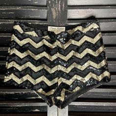 Parisian Collection Women’s Black & Gold Sequined Chevron Mini Shorts Size Small (S) Measures: 13.5” Across Waist | 10” Length | 1.5” Inseam Side Zip Closure Fully Lined New With Tags Fitted Black Shorts For Party, Black Short Length Bottoms For Party, Black Sequined Short Bottoms, Chic Fitted Sequin Shorts, Trendy Black Sequined Bottoms, Black High-waisted Shorts For Party, Black Short Bottoms For Party, Chic Party Season Shorts For Night Out, Chic Shorts For Night Out Party Season