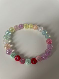 very cute colourful bracelet made with 8mm beads, custom name available with silver letters. a variety of size bracelets available. Please note the colour of the letter beads will be picked at random If you require a different size bracelet please leave a note after purchase. You can also request the bracelet without a name, this will then just be made with a mixture of coloured beads. Please leave a note to advise what name/word/no name is required. Colourful Bracelet, Colorful Bead Bracelets, Bracelet Cute, 8mm Beads, Silver Bow, Bracelet Ideas, Letter Beads, Cute Necklace, Girls Birthday