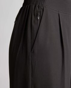 These look like classic work pants, but move like your favorite activewear. Our cropped Performance Tech Wide Leg Commuter Pants have just the right amount of stretch for days when you’re on the go, plus the sun protection and quick-dry properties of top-notch performance wear. And they look great with sneakers.  | Quince | Women's Performance Tech Wide Leg Pants in Black, Size XL, Recycled Polyester Black Athletic Pants, Golf Pants Women, Work Pants Women, Prom Dresses Vintage, Performance Leggings, Golf Pants, Performance Wear, Athletic Pants, Work Pants