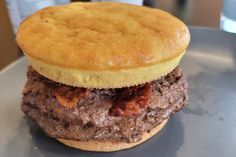 a close up of a hamburger on a plate