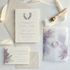 the wedding stationery is laid out and ready to be put into their guests'envelopes