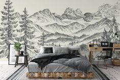 a bedroom with a mountain mural on the wall and a bed in front of it