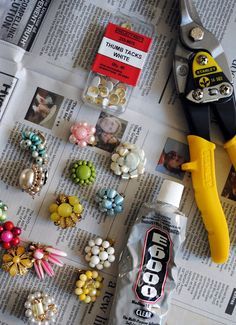 the newspaper is full of different types of buttons and bead supplies, including scissors