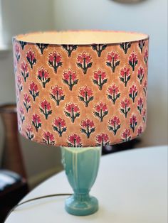 a lamp that is on top of a table