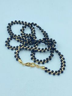 Vintage Trifari black beads on gold tone braided chain necklace. This delicate signed Trifari black bead necklace is 24.5 inches long and 1/4 inch wide. It has a spring ring clasp and is in excellent condition, both the beads and the gold tone chain. Signed Trifari TM on the metal hang tag.  Please see the photos and don't hesitate to contact me to ask any of your questions and stop by my shop at VintageByCarolynJoy.etsy.com. SHIPPING AND RETURNS: Items are shipped in a cotton filled kraft or go Beaded Necklace Black, Trifari Jewelry, Vintage Trifari, Black Bead Necklace, Black Seed, Black Braids, Seed Bead Necklace, Black Necklace, Black Beads