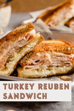 a turkey reuben sandwich cut in half on a plate with the words turkey reuben sandwich