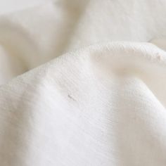 a close up view of a white fabric