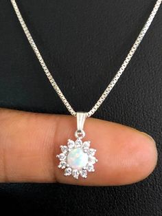 Dainty & Tiny White Opal Necklace, Art Deco CZ Wedding NecklacesNECKLACE FEATURES:Metal:  All components are made from solid .925 Sterling Silver Model is wearing 16" in length solid .925 Sterling Silver Chain Length available:  16", 18" or 20"Stone: Lab-Created White Opal & Cubic Zirconia PendantMeasurement: Height 15MM (0.6"), including bailWidth 9MM (0.4")Your Tiny White Opal Necklace will arrive in a gift box, beautifully wrapped and ready for giftingPlease send me a message if you h White Opal Necklace, White Necklaces With Sparkling Round Cut Stones, White Round Cut Necklaces With Sparkling Stones, White Sparkling Stones Round Cut Necklace, Dazzling White Round Necklaces, White Rhinestone Necklace For Formal Occasions, Cubic Zirconia Necklace With Round Stone For Wedding, White Crystal Round Pendant Necklaces, Wedding Necklace With Cubic Zirconia Round Stone