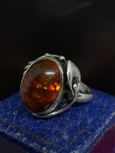 Here we have a stunning vintage statement ring with a beautiful art nouveau inspired design set with sparkling natural Baltic amber gemstone in sterling silver marked 925 UK size - P US size - 7.75 Message me any questions  ITEM - S2216 Antique Amber Round Ring, Antique Amber Ring For Formal Occasions, Art Nouveau Style Oval Ring For A Gift, Vintage Oval Cabochon Ring As Gift, Formal Amber Rings, Unique Amber Rings For Formal Occasions, Vintage Oval Cabochon Ring As A Gift, Vintage Amber Rings For Anniversary, Vintage Amber Oval Ring