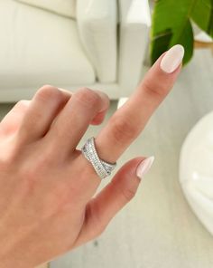 This unique ring is beloved for its versatility - it can add a pop of sparkle to any casual look, or, wear it as a finishing touch for a special occasion. White Gold Cubic Zirconia Ring With Baguette Diamonds, Diamond Ring With Baguette Diamonds And Open Ring Shape, Open Ring With Baguette Diamonds, Dazzling Diamond Rings With Baguette Diamonds, Diamond Rings With Baguette Diamonds In Open Ring Style, Dazzling Baguette Diamond Round Cut Rings, Cubic Zirconia Rings With Baguette Diamonds And Baguette Cut, Cubic Zirconia Rings With Baguette Diamonds, White Gold Open Ring With Baguette Diamonds