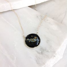 "This Solar System Necklace has glowing glass microbeads carefully hand placed to create our sun and planets on a backdrop of the shimmering milky way galaxy. The scene floats in a sparkling inky resin and is covered with a clear dome, adding a dimensions and depth to this celestial scene. Stamped with the word STARDUST, the bezel is hand cast from your choice of sterling silver or bronze and hangs from a 14k gold filled or sterling silver chain. Each piece has a charm hand stamped with a starbu Sun And Planets, Virgo Jewelry, Solar System Necklace, Virgo Necklace, Galaxy Necklace, Planet Necklace, Astrology Necklace, Silver Highlights, Zodiac Sign Necklace