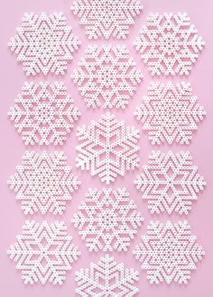 white snowflakes are arranged on a pink background with space for the wording