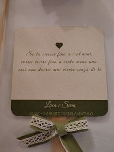 a card with a heart on it and a ribbon tied around the back of it