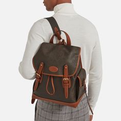 The Heritage collection was designed in tribute to the early bags of Mulberry, which were inspired by English country pursuits. The Heritage Backpack features practical pockets, belt and buckle strap detailing and a signature logo plaque. The straps can be adjusted to a personal fit and all your belongings are secured under the front flap. One internal zipped pocket Foil embossed Mulberry signature Adjustable shoulder straps in webbing Two Sam Browne studs for quick opening of the flap, with fun Luxury Coated Canvas Backpack With Leather Handles, Luxury Backpack With Leather Handles And Coated Canvas, Classic Backpack With Detachable Strap, Luxury Brown Backpack For School, Luxury Brown School Backpack, Classic Cognac Backpack For Travel, Classic Flap Bag With Buckle Closure, Classic Cognac Travel Backpack, Classic Brown Backpack With Adjustable Strap