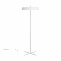 a floor lamp with a white shade on the base and a cord attached to it