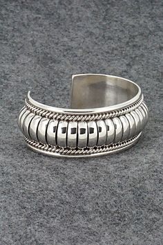 This stunning sterling silver bracelet was made by Navajo silversmith Thomas Charley. The inside is signed TC and stamped sterling.Size: 5 1/4" (will fit up to a 6 1/2" wrist)Gap: 1 1/4"Width: 1"Free shipping on all orders! We ship with USPS and always include tracking. All orders ship within a day of payment.Returns are accepted up to 30 days after you receive your order. Just send us a message. Our shop offers cash back or store credit. The item must be returned in new condition. Sterling Silver Bracelet, Bracelets And Charms, Sterling Silver Bracelets, Ebay Finds, Silver Bracelet, Gap, Jewelry Bracelets, Product Information, Bracelet