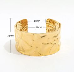 This trendy vintage cuff will dazzle any wardrobe. Whether on a beach trip or a night out with friends, this alluring cuff will sure be noticed by all. Pair with any HOJM ring or earrings for a luxurious look. Size: Adjustable cuff Material: Gold plated over Stainless Steel base . Tarnish and Water Resistant Allergies: Hypoallergenic Adjustable Open Cuff Jewelry For Party, Party Open Cuff Bracelet, Luxury Summer Party Jewelry, Trendy Cuff Bangle For Parties, Elegant Metal Bracelets For Beach, Gold Open Cuff Bracelets For Party, Elegant Summer Wedding Bracelets, Chic Metal Cuff Bangle Bracelet, Chic Metal Bangle Cuff Bracelet