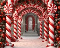 an archway decorated for christmas with candy canes and decorations on the outside, along with red and white ornaments