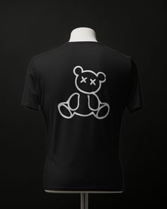 Elevate your wardrobe with our "Cool Aesthetic Classy Teddy Bear Design T-Shirt." This modern tee combines sophistication with a touch of whimsy, featuring a stylish teddy bear graphic that adds a playful twist to your urban look. Crafted with meticulous attention to detail, this shirt boasts a contemporary design that seamlessly blends into the world of pop culture and urban fashion. The classy teddy bear motif exudes charm and personality, making it a standout piece in any wardrobe. Made from premium-quality materials, this t-shirt offers both comfort and style for everyday wear. Whether you're exploring the city streets, hanging out with friends, or hitting the town for a night out, this shirt is sure to turn heads and spark conversations. Ideal for trendsetters and fashion-forward indi Trendy Crew Neck T-shirt With Bear Print, Crew Neck T-shirt With Bear Print For Streetwear, Bear Print Crew Neck T-shirt For Streetwear, White Crew Neck T-shirt With Bear Print, Black Crew Neck Top With Bear Print, White Bear Design Short Sleeve Tops, Casual White T-shirt With Bear Design, White Short Sleeve Top With Bear Design, Graphic Tee With Bear Print For Streetwear