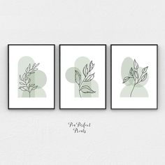 three framed art prints with leaves on them, one in green and the other in white