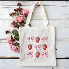 Strawberry Coquette Tote bag is perfect for strawberry lovers out there! Design is sublimated onto the Canvas Tote bag and will not fade over time. Includes: 1 x 12 x 14.5 Canvas Tote bag CARE ♡This is decorated with permanent print that does not fade or peel. RETURN POLICY ♡If your order is customized as requested, no refunds or exchanges will be offered. ♡If there was a mistake or misspelling on my part, please contact me so I can send a replacement free of charge. SHIPPING ♡All items are ship Rectangular Strawberry Print Bag For Gifts, Rectangular Bags With Strawberry Print For Gifts, Rectangular Bag With Strawberry Print As Gift, Rectangular Strawberry Print Bag As A Gift, Rectangular Bags With Strawberry Print As Gift, Pink Strawberry Print Bag As Gift, Custom Beach Bags, Gift Totes, Teenage Girl Gifts