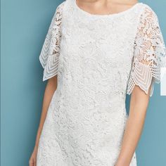 Beautiful, Popular Charleston Lace Mini Dress From Anthropologie. From The Office To A Summer Soiree To A Bridal Or Wedding Party, This Versatile White Lace Dress Makes An Elegant Statement At Any Occasion. White Shift Style Mini Dress With Beautiful, Intricate Floral Embroidered Lace. Scalloped Hem. Short Sheer Sleeves; Wide Boat Neck. Hidden Zipper At Side. Polyester; Rayon Lining. Retail: $240. New Without Tags Short Sleeve Scalloped Lace Dress For Wedding Guest, Scalloped Lace Short Sleeve Dress For Wedding Guest, Summer Lace Dress For Mother Of The Bride, Elegant Brunch Dress With Scalloped Lace, Feminine Mother Of The Bride Summer Dress, Summer Sheath Dress With Lace Sleeves, Summer White Dress For Mother Of The Bride, Chic Spring Dresses For Mother Of The Bride, Chic Summer Dress For Mother Of The Bride