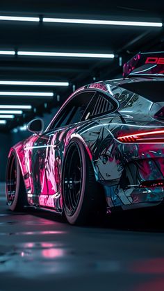 a pink car parked in a parking garage with neon lights on the side of it