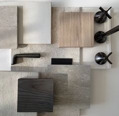 several different types of wood and tile are arranged together in an arrangement on the wall