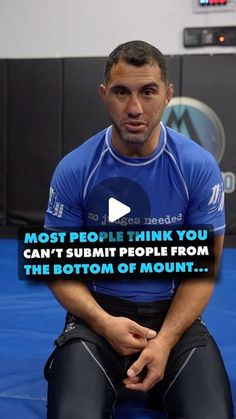 a man sitting on top of a blue mat in front of a tv screen with the caption most people think you can't summit people from the bottom of mount