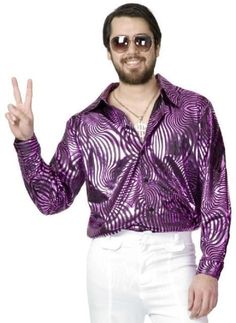 a man in a purple shirt and white pants is making the peace sign with his hand