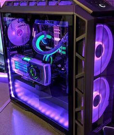 the inside of a computer case with purple lights