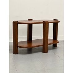 a wooden table sitting on top of a white floor