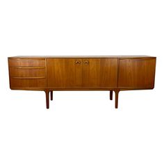 the sideboard is made out of wood and has three drawers on one side, with two