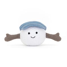 a white and gray stuffed animal with a blue hat