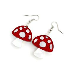 "Add some fun forest vibes to your wardrobe with these adorable mushroom earrings. The mushrooms are laser cut from red and white pearl acrylic making them visually stunning and lightweight. Mushroom charms measure 1.11\" tall and .956\" wide and hang from nickel free earring wires. Handmade in the USA. ★ ★ ★ Become a VIP and get 20% off your first purchase plus access to exclusive sales, sneak peeks and monthly giveaways. Copy and paste this link into your browser to sign up: bit.ly/levantervip Pinup Jewelry, Creepy Earrings, Forest Vibes, Red And White Mushroom, Alice In Wonderland Diy, Retro Mushroom, Cottagecore Earrings, Forest Jewelry, Vintage Inspired Earrings