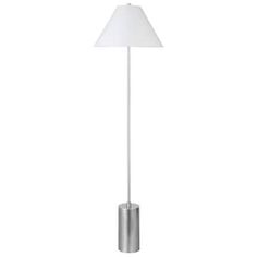 a floor lamp with a white shade on the top and silver base, in front of a