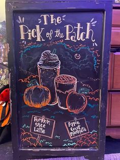 a chalkboard sign with pumpkins and a drink on it that says, the pick of the path