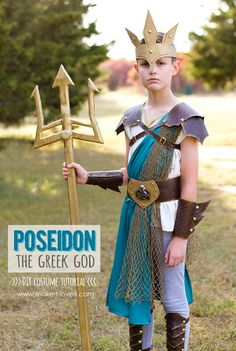 a young boy dressed up as poseion holding a golden sceptacle and an arrow