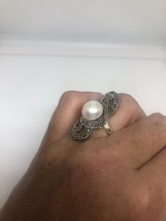 Vintage hand made Genuine Pearl set in 925 Sterling Silver with Marcasite ring Size 7 Can be re sized for you. My jeweler charges about $10-$15 All rings are shipped in a nice gift box. Check out our over a THOUSAND great reviews Engraving is $4 per letter and is not always perfect depending on the piece. It can take a few days if the jeweler is busy. This is payable to Paypal Judithsltd@gmail.com Elegant Sterling Silver Pearl Ring Stamped 925, Elegant Silver Pearl Ring Stamped 925, Elegant Nickel-free Wedding Rings, Elegant Nickel Free Wedding Rings, Silver Sterling Silver Pearl Ring, Hallmarked Sterling Silver Oval Pearl Ring, Hallmarked Oval Pearl Ring In Sterling Silver, Oval Sterling Silver Hallmarked Pearl Ring, Elegant Nickel-free White Rings