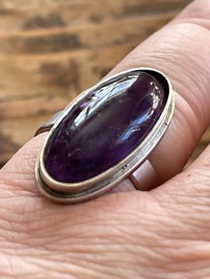 Up for your consideration is a lovely vintage Sterling silver ring from the Norwegian  maker Thune with a gorgeous amethyst It measure 19 mm in inner diameter.  The size is adjustable The shape is not 100% round  Some markes on the stone Please visit us at tonsbergantikk.com Formal Amethyst Oval Cabochon Ring In Silver, Vintage Amethyst Jewelry With Polished Finish, Vintage Amethyst Rings With Polished Finish, Vintage Adjustable Amethyst Ring In Sterling Silver, Adjustable Vintage Sterling Silver Amethyst Ring, Classic Silver Amethyst Ring Oval Cabochon, Classic Silver Amethyst Oval Cabochon Ring, Vintage Amethyst Oval Cabochon Ring, Polished Vintage Amethyst Ring