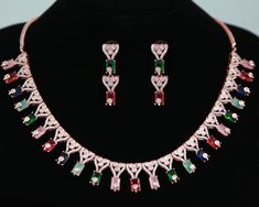 Luxury Look American Diamond CZ color stone necklace earring set in Rose-gold plating. Stone Necklace Designs, American Diamond Necklace Set, Green Statement Necklace, American Diamond Necklaces, Diamond Wedding Jewelry, Big Necklace, Diamond Necklace Set, Kundan Necklaces, Cz Jewelry