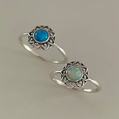 *  Sterling Silver Flower White or Blue Lab Opal, Boho Ring, Mandala Silver Ring, Dainty Ring, Opal Silver Ring, Flower Ring, Floral Ring, October Birthstone Ring, may wear as midi, pinky or thumb ring, 925 Stamped *  The outside ring of a mandala, known as the ring of fire, serves as a boundary between the outer world, full of chaos, and the sanctity found within the mandala. The mystical journey doesn't begin until one has left samsara, the world of phenomena, and passed through the flames serving as the mandala's barrier *  Perfect gift idea for any occasion: birthday, anniversary, engagement, graduation, bridesmaid, Mother's Day, Valentine's Day, Christmas, promise. *  Your purchase includes a gift box. Let us know if this is a gift and we can ship directly to the recipient and include Adjustable Bohemian Blue Flower Ring, Bohemian Blue Stackable Round Rings, Adjustable Blue Flower Ring, Bohemian Blue Opal Ring As A Gift, Mandala Ring, Opal Silver Ring, Silver Flower Ring, October Birthstone Rings, Ring Flower