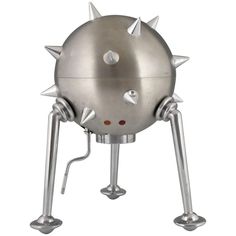 a large metal object with spikes on it's head and legs, sitting in front of a white background