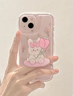 a person holding up a clear phone case with an image of a bunny on it