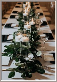 Discover 10 useful ideas for stunning wedding candles that will illuminate your special day. From elegant centerpieces to romantic accents, these wedding candles will create a magical atmosphere for your celebration. Explore creative designs, unique placements, and tips for choosing the perfect scents to enhance your wedding theme. Transform your venue with beautiful candlelight and make unforgettable memories with these inspiring ideas. Dark Flowers Wedding Table Settings, Long Wedding Tables With Greenery, Long Greenery Centerpiece, Black Square Candle Holder Wedding, Rectangle Head Table Wedding Decorations, Dark Eucalyptus Wedding, Low Lush Wedding Centerpieces, Dark Greenery Wedding Centerpieces, Wedding With Rectangle Tables