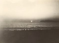 a black and white photo of the ocean